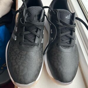 Women’s adidas Black cheetah print golf sneakers